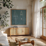 Coastal Blueprint IV by Marco Fabiano. Shown in a natural wood frame in a cozy modern living room. Available as an archival giclee rolled canvas, fine art paper, or poster print. SKU 14064a.