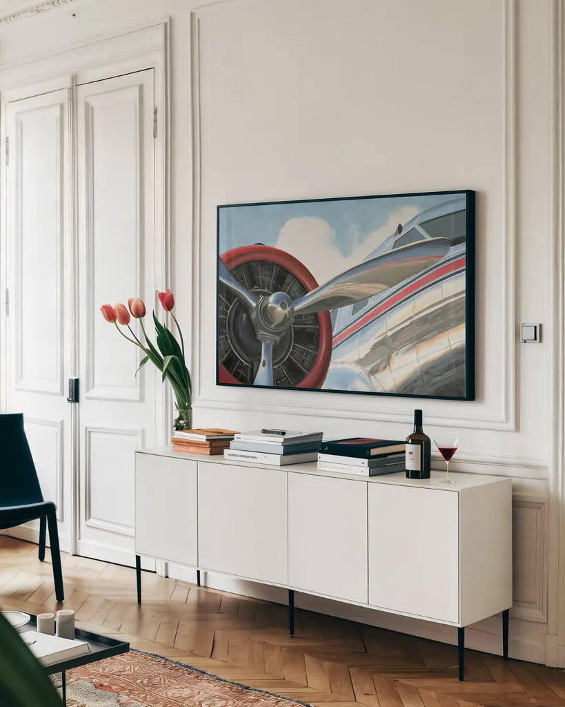 Travel by Air I v2 No Words by Marco Fabiano. shown as a framed stretched canvas in a living room above a console. Available as a archival giclee rolled canvas, fine art paper, or poster print. SKU 33821i.