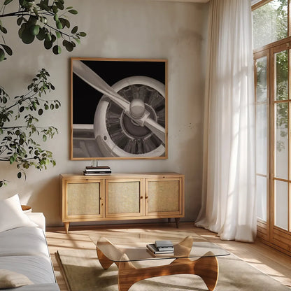 Travel by Air III Dark by Marco Fabiano. Shown in a natural wood frame in a cozy modern living room. Available as an archival giclee rolled canvas, fine art paper, or poster print. SKU 14267a.