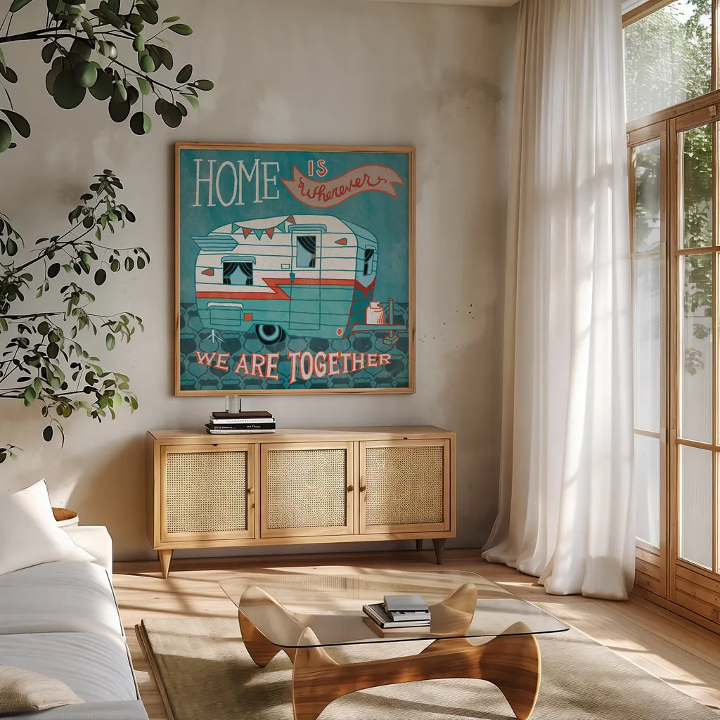 Adventure Love Camper by Mary Urban. Shown in a natural wood frame in a cozy modern living room. Available as an archival giclee rolled canvas, fine art paper, or poster print. SKU 20965a.