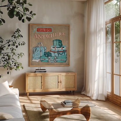 Adventure Love Suitcase Taupe by Mary Urban. Shown in a natural wood frame in a cozy modern living room. Available as an archival giclee rolled canvas, fine art paper, or poster print. SKU 20854a.