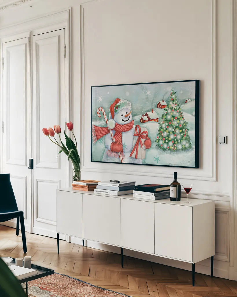 Classic Snowmen I by Mary Urban. shown as a framed stretched canvas in a living room above a console. Available as a archival giclee rolled canvas, fine art paper, or poster print. SKU 47162i.