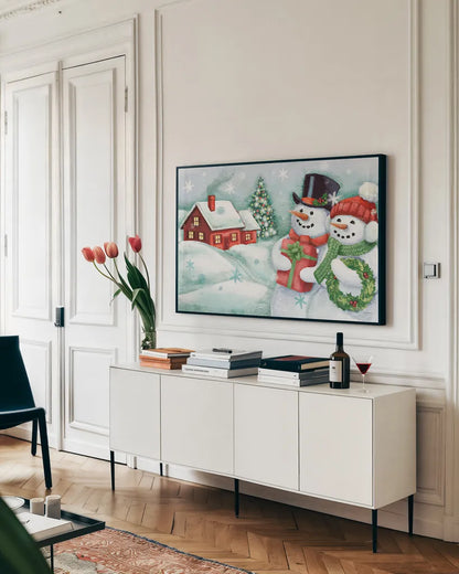Classic Snowmen II by Mary Urban. shown as a framed stretched canvas in a living room above a console. Available as a archival giclee rolled canvas, fine art paper, or poster print. SKU 47163i.