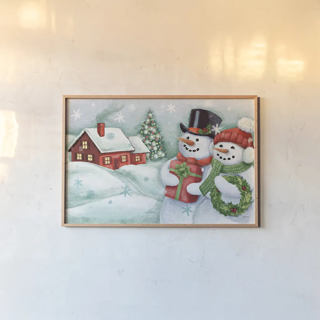 Classic Snowmen II by Mary Urban. shown as a paper print in a natural frame. Available as a archival giclee rolled canvas, fine art paper, or poster print. SKU 47163i.