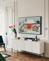 Classic Snowmen III by Mary Urban. shown as a framed stretched canvas in a living room above a console. Available as a archival giclee rolled canvas, fine art paper, or poster print. SKU 47164i.