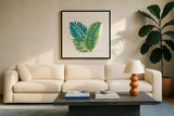 Coconut Palm VI by Mary Urban. Displayed in a glass frame with matte in a clean modern living room. Available as an archival giclee rolled canvas, fine art paper, or poster print. SKU 56374a.