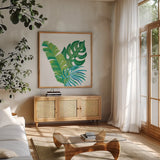 Coconut Palm VII by Mary Urban. Shown in a natural wood frame in a cozy modern living room. Available as an archival giclee rolled canvas, fine art paper, or poster print. SKU 56375a.