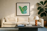 Coconut Palm VII by Mary Urban. Displayed in a glass frame with matte in a clean modern living room. Available as an archival giclee rolled canvas, fine art paper, or poster print. SKU 56375a.