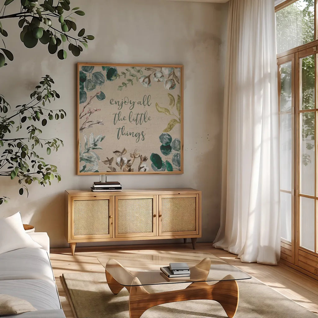 Cotton Bouquet V by Mary Urban. Shown in a natural wood frame in a cozy modern living room. Available as an archival giclee rolled canvas, fine art paper, or poster print. SKU 62168a.