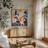 Happy Place II Blue by Mary Urban. Shown in a natural wood frame in a cozy modern living room. Available as an archival giclee rolled canvas, fine art paper, or poster print. SKU 53679a.
