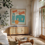 Let's Do Coffee Orange by Mary Urban. Shown in a natural wood frame in a cozy modern living room. Available as an archival giclee rolled canvas, fine art paper, or poster print. SKU 36499a.