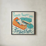 Love Keeps Us Together Orange by Mary Urban. Shown in a sleek black glass frame for a contemporary gallery look. Available as an archival giclee rolled canvas, fine art paper, or poster print. SKU 30512a.