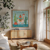 Lovely Llamas Christmas II by Mary Urban. Shown in a natural wood frame in a cozy modern living room. Available as an archival giclee rolled canvas, fine art paper, or poster print. SKU 47234a.
