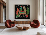 Lovely Llamas III Christmas Black by Mary Urban. Shown as extra-large giant wall art in a modern living room. Available as an archival giclee rolled canvas, fine art paper, or poster print. SKU 43977a.
