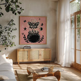 Mystical Halloween Pink VIII by Mary Urban. Shown in a natural wood frame in a cozy modern living room. Available as an archival giclee rolled canvas, fine art paper, or poster print. SKU 48096a.