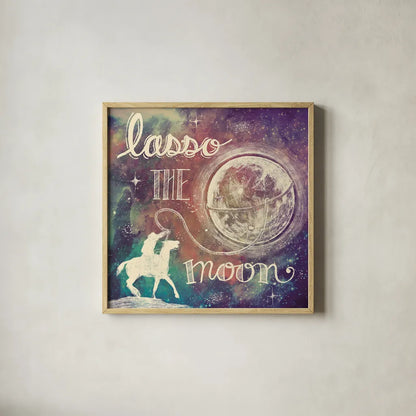 Universe Galaxy Lasso the Moon Sq by Mary Urban. Shown in a natural wood glass frame for a timeless modern aesthetic. Available as an archival giclee rolled canvas, fine art paper, or poster print. SKU 18443a.