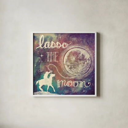 Universe Galaxy Lasso the Moon Sq by Mary Urban. Shown in a crisp white glass frame for a clean and minimalist style. Available as an archival giclee rolled canvas, fine art paper, or poster print. SKU 18443a.