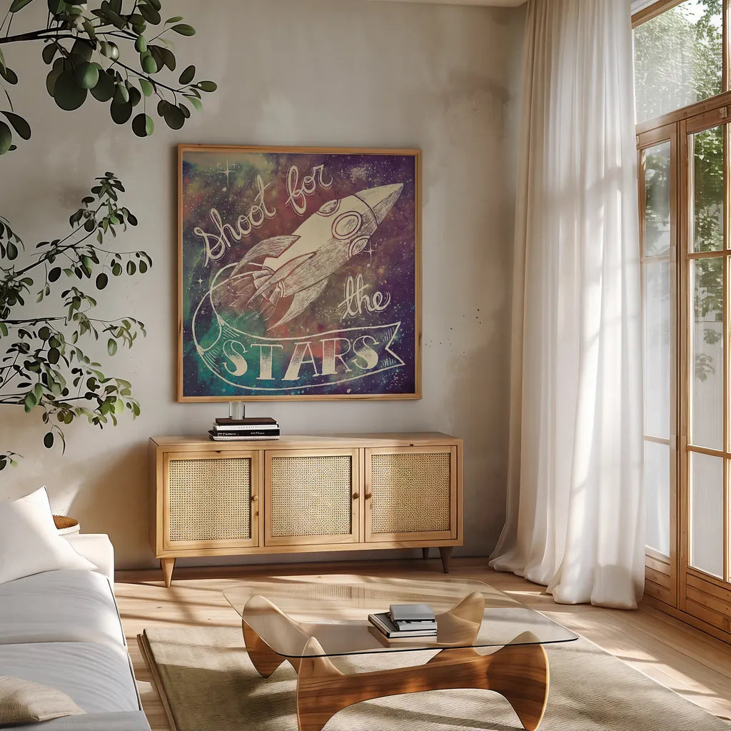 Universe Galaxy Shoot for the Stars by Mary Urban. Shown in a natural wood frame in a cozy modern living room. Available as an archival giclee rolled canvas, fine art paper, or poster print. SKU 18445a.