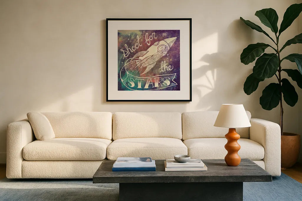Universe Galaxy Shoot for the Stars by Mary Urban. Displayed in a glass frame with matte in a clean modern living room. Available as an archival giclee rolled canvas, fine art paper, or poster print. SKU 18445a.