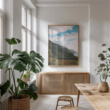 Clouds over Hawaii by Max Blakesberg Studios. shown as a print in a natural wood frame in a dining room. Available as a archival giclee rolled canvas, fine art paper, or poster print. SKU 93620h.