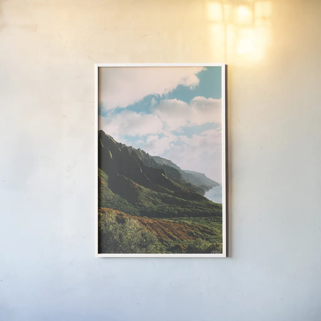 Clouds over Hawaii by Max Blakesberg Studios. shown as a paper print in a white frame. Available as a archival giclee rolled canvas, fine art paper, or poster print. SKU 93620h.