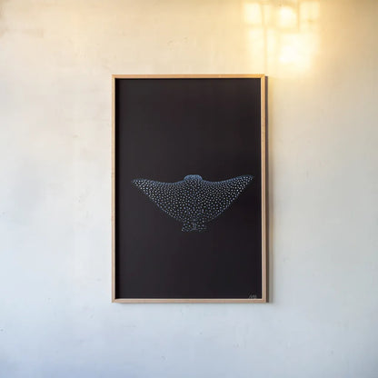 Eagle Ray Dark by Max Blakesberg Studios. shown as a paper print in a natural frame. Available as a archival giclee rolled canvas, fine art paper, or poster print. SKU 90982h.
