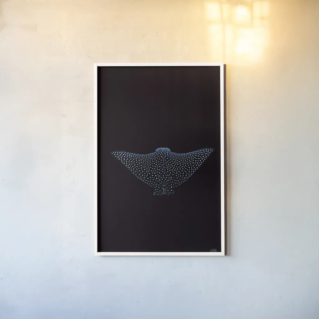 Eagle Ray Dark by Max Blakesberg Studios. shown as a paper print in a white frame. Available as a archival giclee rolled canvas, fine art paper, or poster print. SKU 90982h.