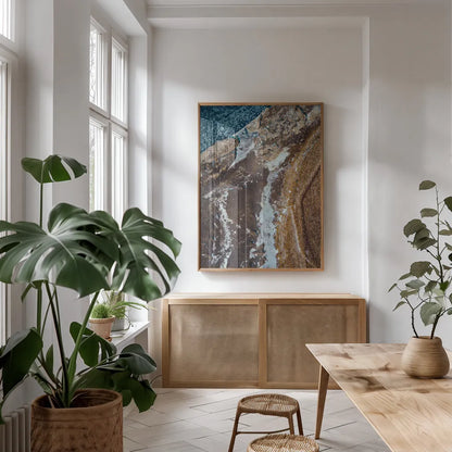 Iceland From Above II by Max Blakesberg Studios. shown as a print in a natural wood frame in a dining room. Available as a archival giclee rolled canvas, fine art paper, or poster print. SKU 90839h.