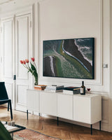 Iceland Shores I by Max Blakesberg Studios. shown as a framed stretched canvas in a living room above a console. Available as a archival giclee rolled canvas, fine art paper, or poster print. SKU 90840i.