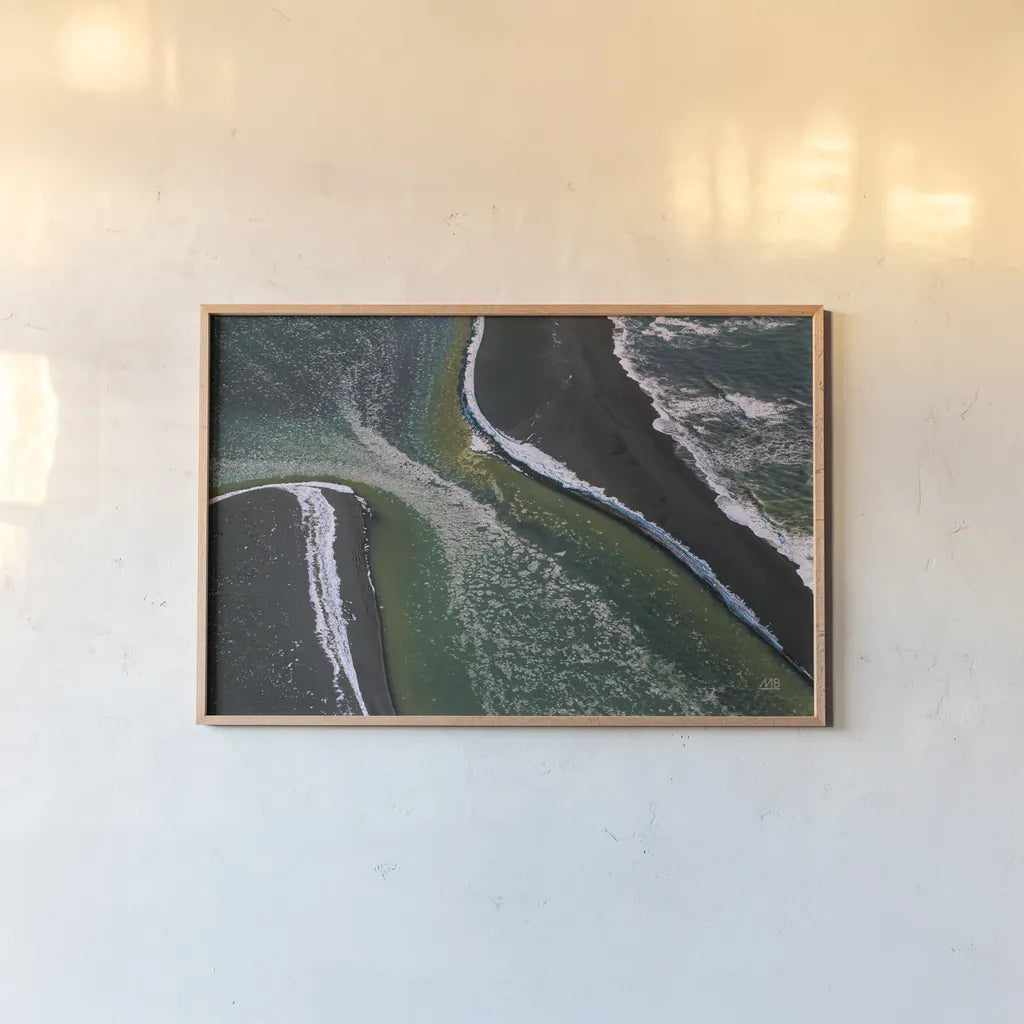 Iceland Shores I by Max Blakesberg Studios. shown as a paper print in a natural frame. Available as a archival giclee rolled canvas, fine art paper, or poster print. SKU 90840i.