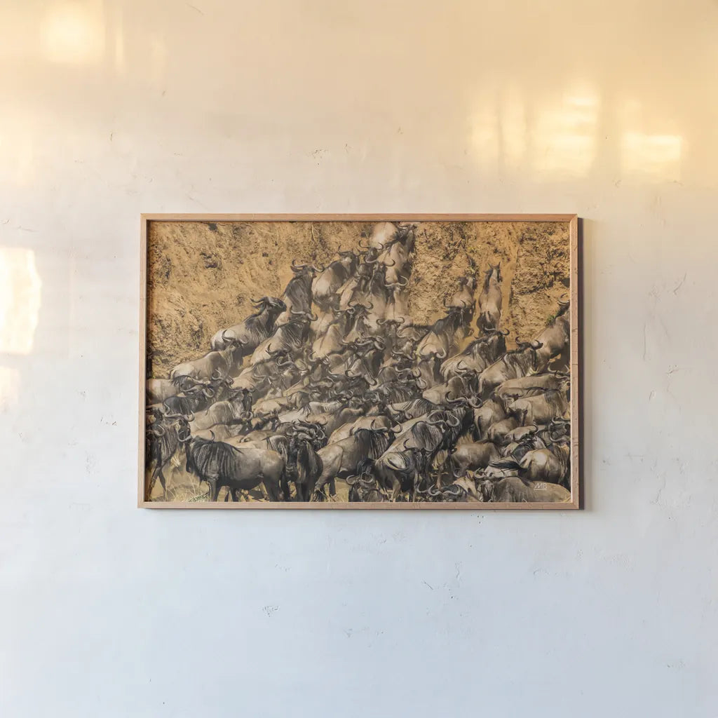 Kenyan Herd I by Max Blakesberg Studios. shown as a paper print in a natural frame. Available as a archival giclee rolled canvas, fine art paper, or poster print. SKU 92809i.