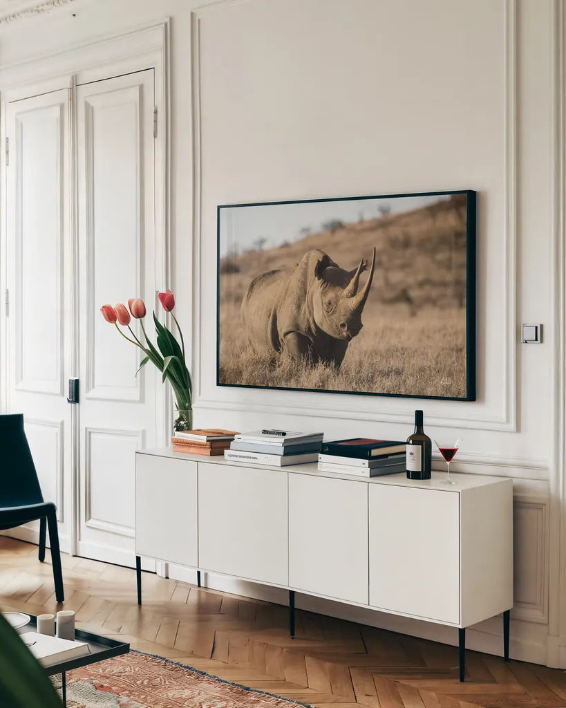Kenyan Rhino by Max Blakesberg Studios. shown as a framed stretched canvas in a living room above a console. Available as a archival giclee rolled canvas, fine art paper, or poster print. SKU 93610i.
