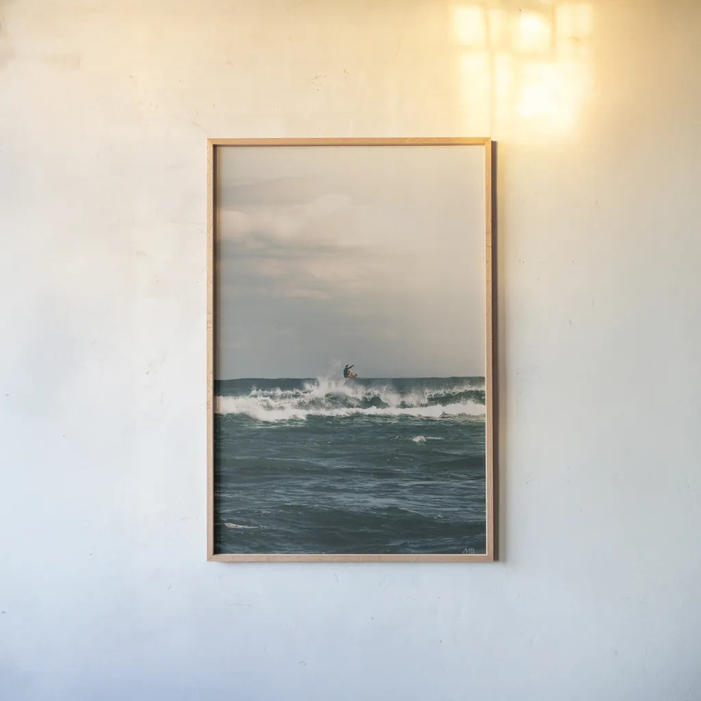 Ride the Tide by Max Blakesberg Studios. shown as a paper print in a natural frame. Available as a archival giclee rolled canvas, fine art paper, or poster print. SKU 91870h.