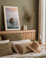 Sunrise Swim by Max Blakesberg Studios. shown as a paper print in a natural frame. Available as a archival giclee rolled canvas, fine art paper, or poster print. SKU 91647h.