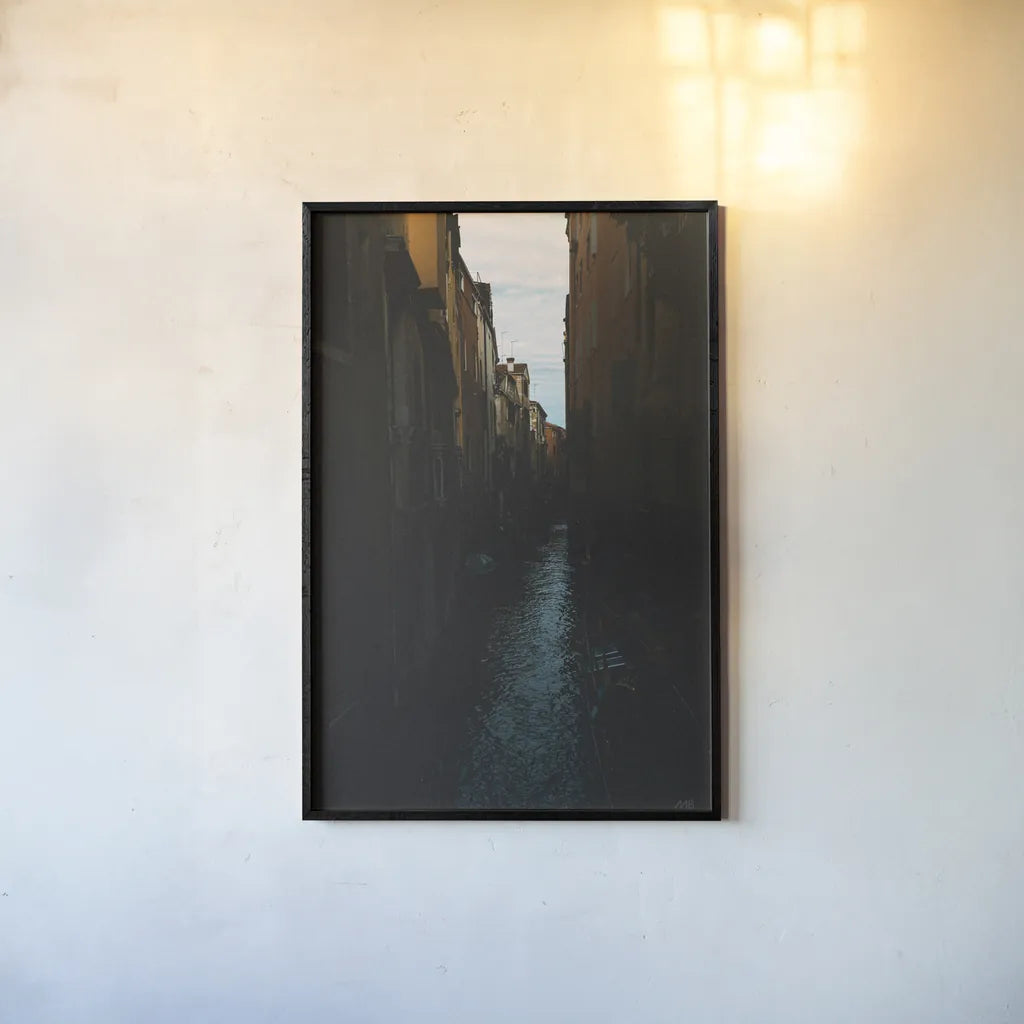 Venice Canal by Max Blakesberg Studios. shown as a paper print in a black flame. Available as a archival giclee rolled canvas, fine art paper, or poster print. SKU 91648h.