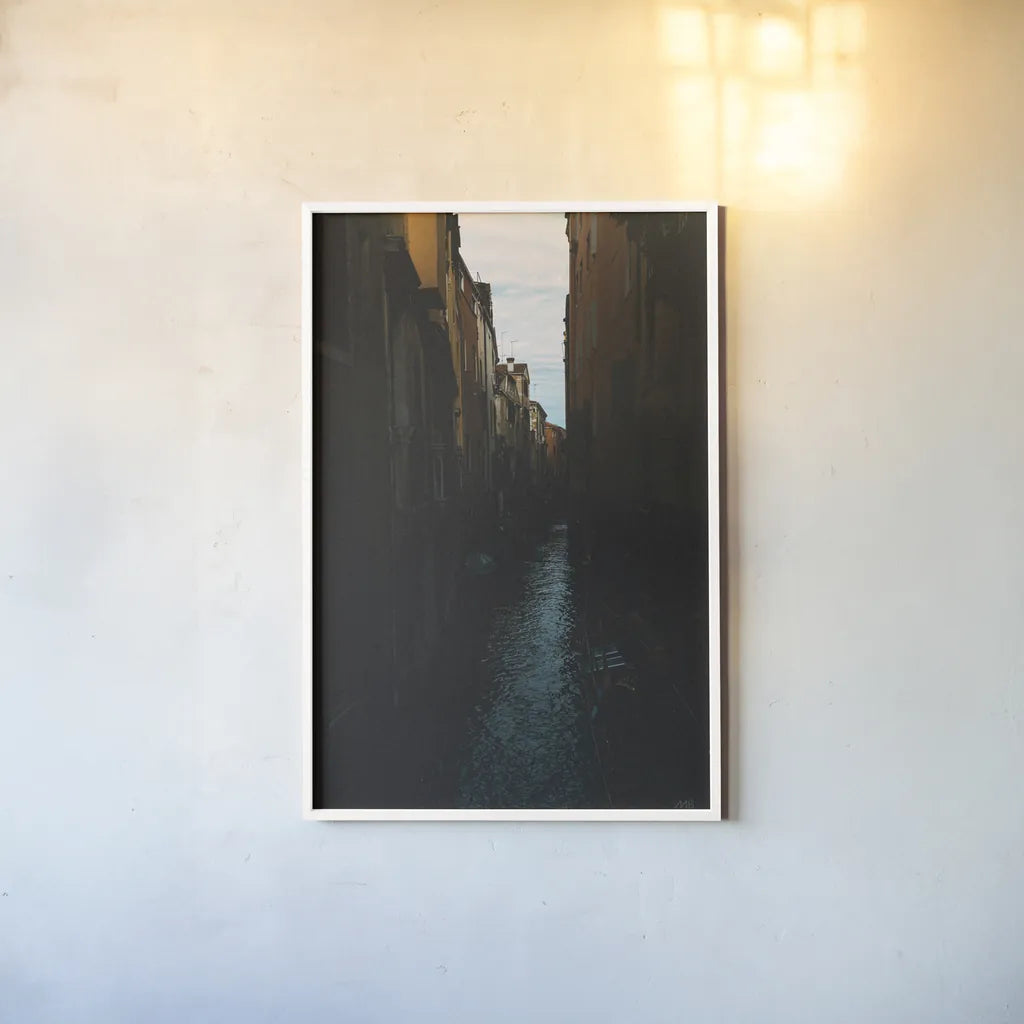 Venice Canal by Max Blakesberg Studios. shown as a paper print in a white frame. Available as a archival giclee rolled canvas, fine art paper, or poster print. SKU 91648h.