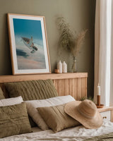 Wave Hello by Max Blakesberg Studios. shown as a paper print in a natural frame. Available as a archival giclee rolled canvas, fine art paper, or poster print. SKU 92686h.