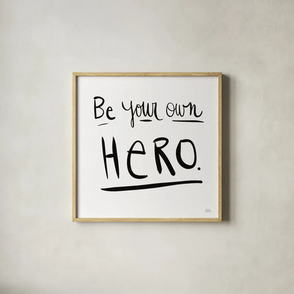 Be Your Own Hero by Melissa Averinos. Shown in a natural wood glass frame for a timeless modern aesthetic. Available as an archival giclee rolled canvas, fine art paper, or poster print. SKU 64426a.