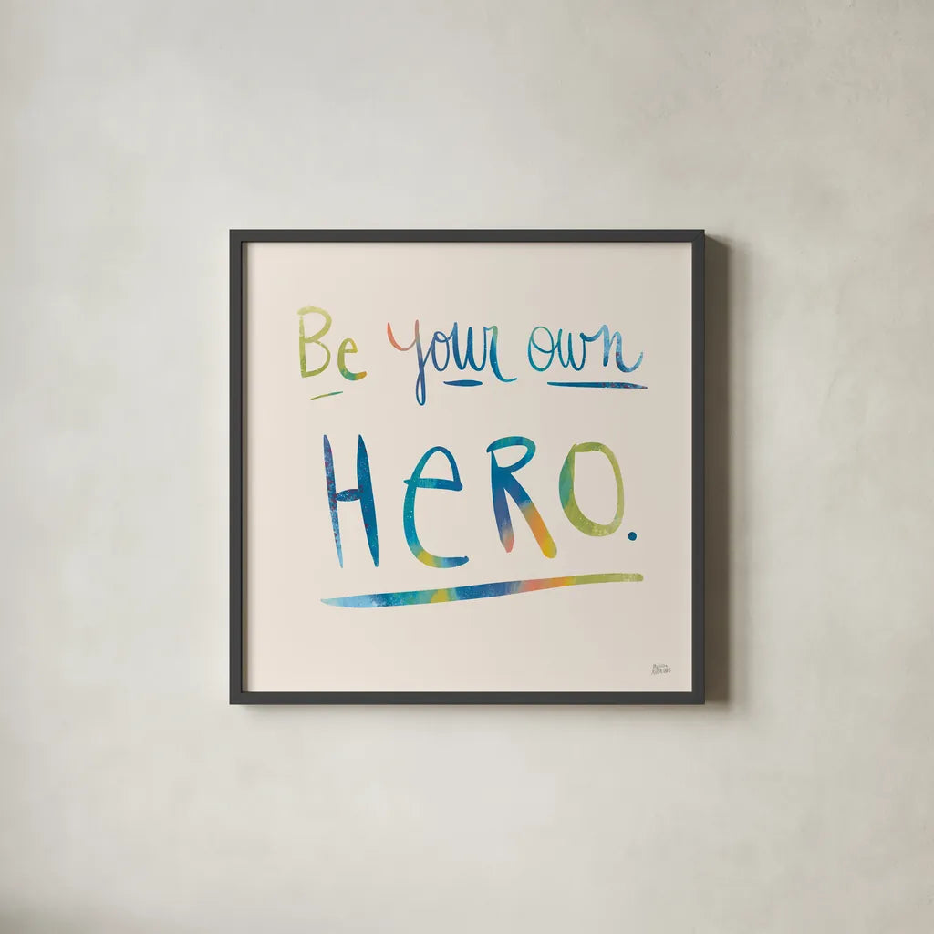 Be Your Own Hero Colorful by Melissa Averinos. Shown in a sleek black glass frame for a contemporary gallery look. Available as an archival giclee rolled canvas, fine art paper, or poster print. SKU 77929a.
