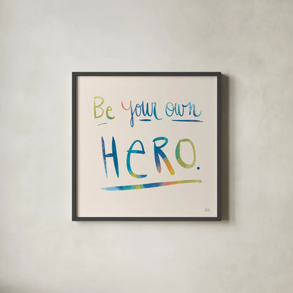 Be Your Own Hero Colorful by Melissa Averinos. Shown in a sleek black glass frame for a contemporary gallery look. Available as an archival giclee rolled canvas, fine art paper, or poster print. SKU 77929a.