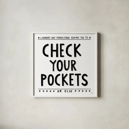 Check Your Pockets by Melissa Averinos. Shown in a crisp white glass frame for a clean and minimalist style. Available as an archival giclee rolled canvas, fine art paper, or poster print. SKU 59179a.