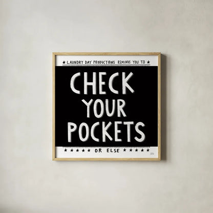 Check Your Pockets by Melissa Averinos. Shown in a natural wood glass frame for a timeless modern aesthetic. Available as an archival giclee rolled canvas, fine art paper, or poster print. SKU 59465a.