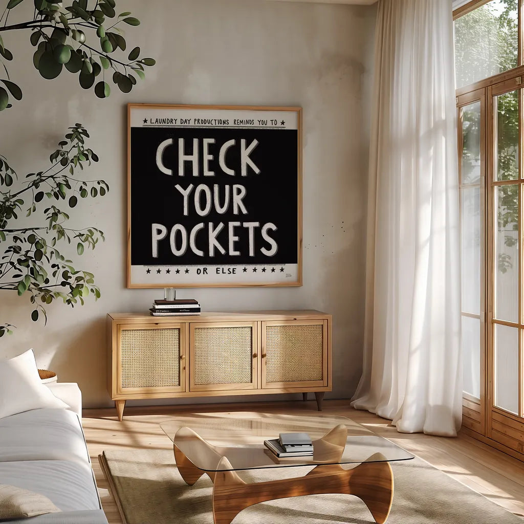 Check Your Pockets by Melissa Averinos. Shown in a natural wood frame in a cozy modern living room. Available as an archival giclee rolled canvas, fine art paper, or poster print. SKU 59465a.