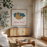 Colorful Sloth II v2 by Melissa Averinos. Shown in a natural wood frame in a cozy modern living room. Available as an archival giclee rolled canvas, fine art paper, or poster print. SKU 56792a.