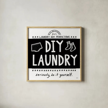 DIY Laundry BW by Melissa Averinos. Shown in a natural wood glass frame for a timeless modern aesthetic. Available as an archival giclee rolled canvas, fine art paper, or poster print. SKU 59466a.