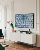 Eclipse I by Melissa Averinos. shown as a framed stretched canvas in a living room above a console. Available as a archival giclee rolled canvas, fine art paper, or poster print. SKU 29237i.