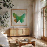 Flight Patterns Butterfly II by Melissa Averinos. Shown in a natural wood frame in a cozy modern living room. Available as an archival giclee rolled canvas, fine art paper, or poster print. SKU 25937a.