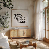 Good Vibes by Melissa Averinos. Shown in a natural wood frame in a cozy modern living room. Available as an archival giclee rolled canvas, fine art paper, or poster print. SKU 64427a.