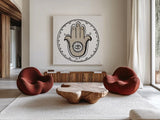 Graphic Hamsa by Melissa Averinos. Shown as extra-large giant wall art in a modern living room. Available as an archival giclee rolled canvas, fine art paper, or poster print. SKU 64430a.