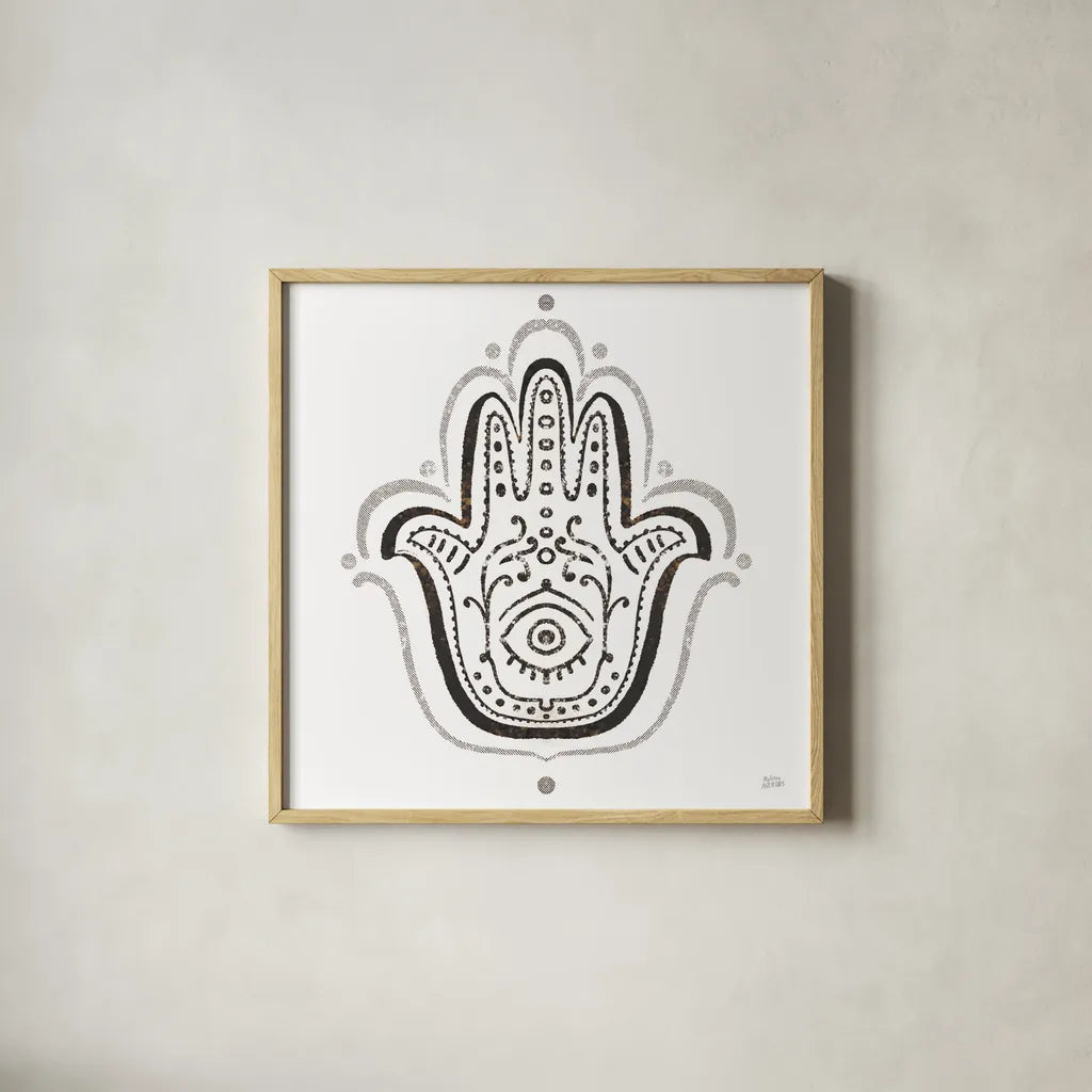 Hamsa Amulet in Black by Melissa Averinos. Shown in a natural wood glass frame for a timeless modern aesthetic. Available as an archival giclee rolled canvas, fine art paper, or poster print. SKU 64429a.